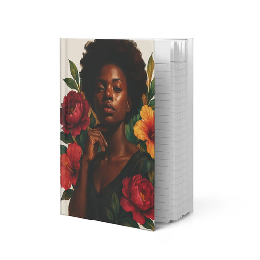 Beautiful Black woman surrounded by vibrant pink and yellow roses with flowers in her hair on hardcover journal for Black women, self-care and empowerment notebook